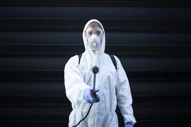professional-exterminator-pointing-sprayer-nozzle-pest-control-camera